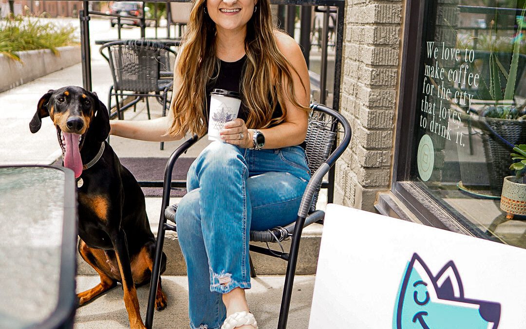 woman and her dog sitting on the patio at Omaha's Zen Coffee
